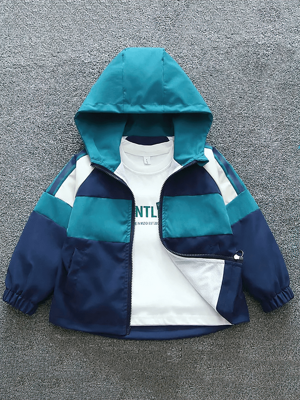 Teal and navy kids' colorblock hooded windbreaker jacket, zip-up design with elastic cuffs. Ideal for outdoor play and light rain.